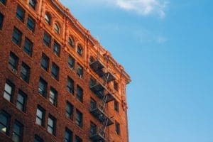 Street view of old brick apartment unit