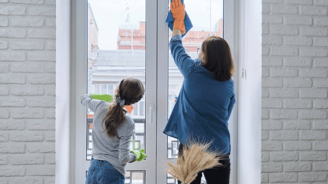 A family inspecting and cleaning a new house